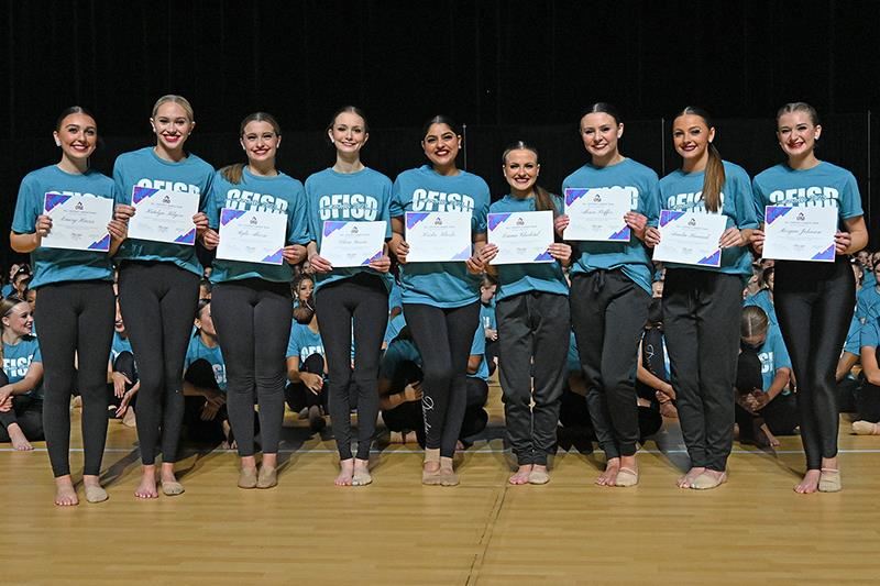 CFISD dancers display their All-District Dance Team Scholarships they received at the conclusion of the CFISD Dance ShowOffs.